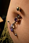 Piercing nombril cerises violettes